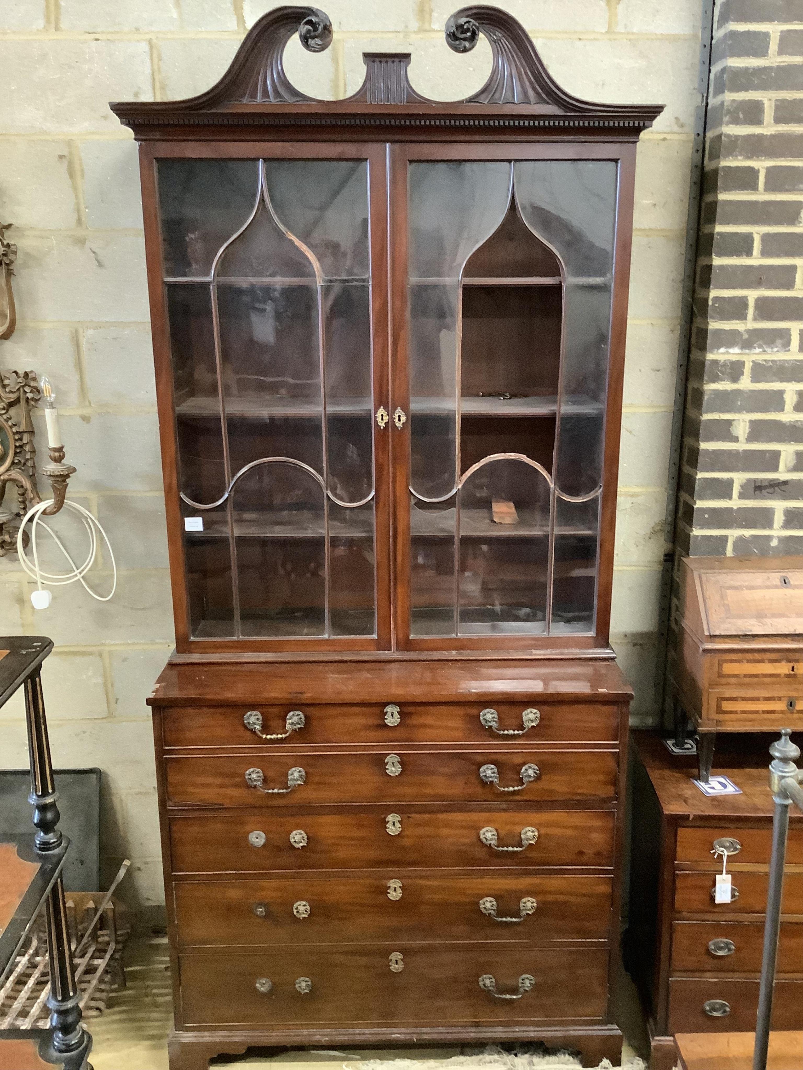 A George III mahogany secretaire chest, fitted with a later glazed two door bookcase, width 112cm, depth 56cm, height 247cm. Condition - poor